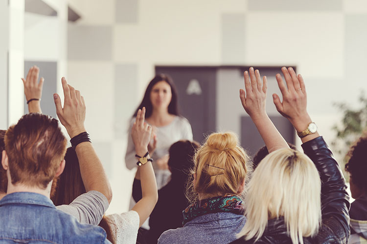 Students raising their hands